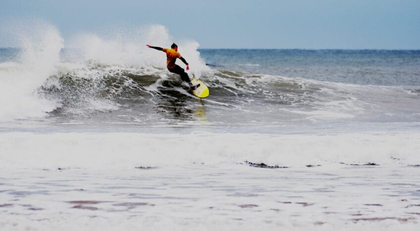 Surfer Wearing Wetsuit During The Day